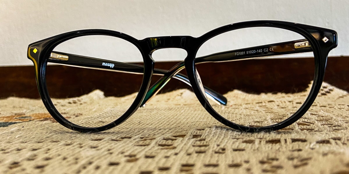black glasses in oval frame