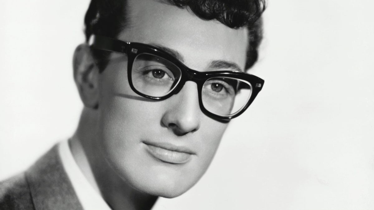 buddy holly wearing a pair of black glasses frames
