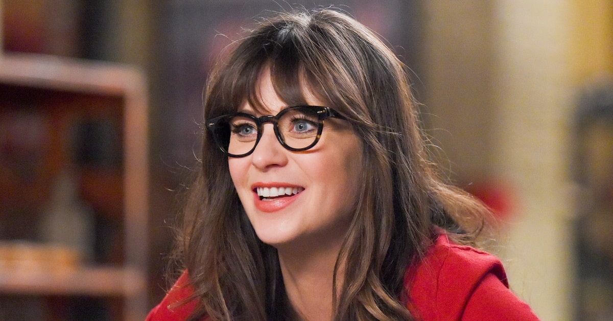 zooey deschanel wearing glasses matching her skin tone