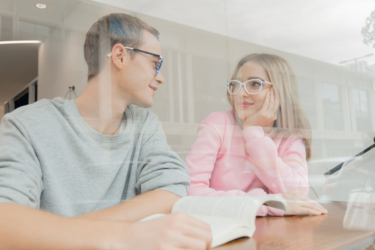 a couple wearing glasses with anti reflective and anti glare coatings