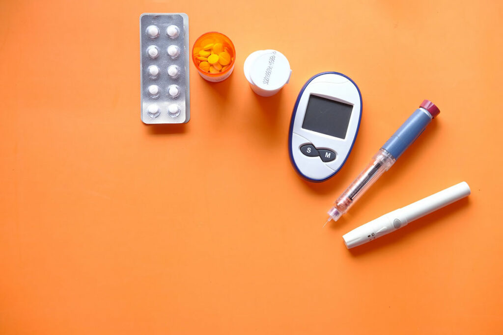 assortment of medications and tools related to diabetes that can affect eye health
