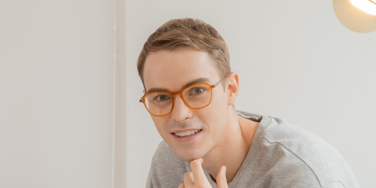 man wearing mouqy orange glasses