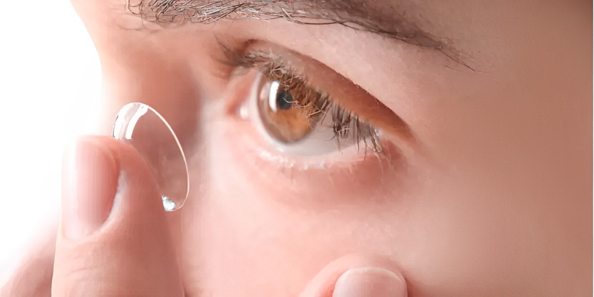 a person with farsightedness putting on contact lenses