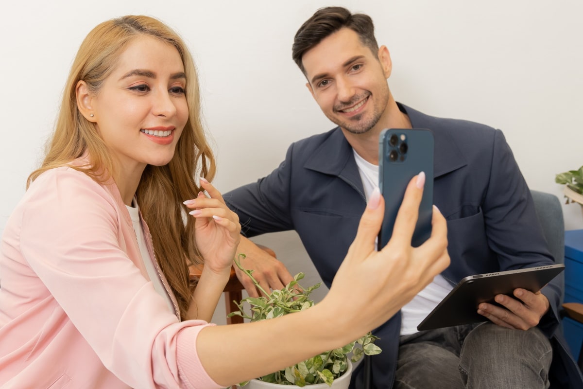 a couple trying out glasses frame using mouqy virtual try on