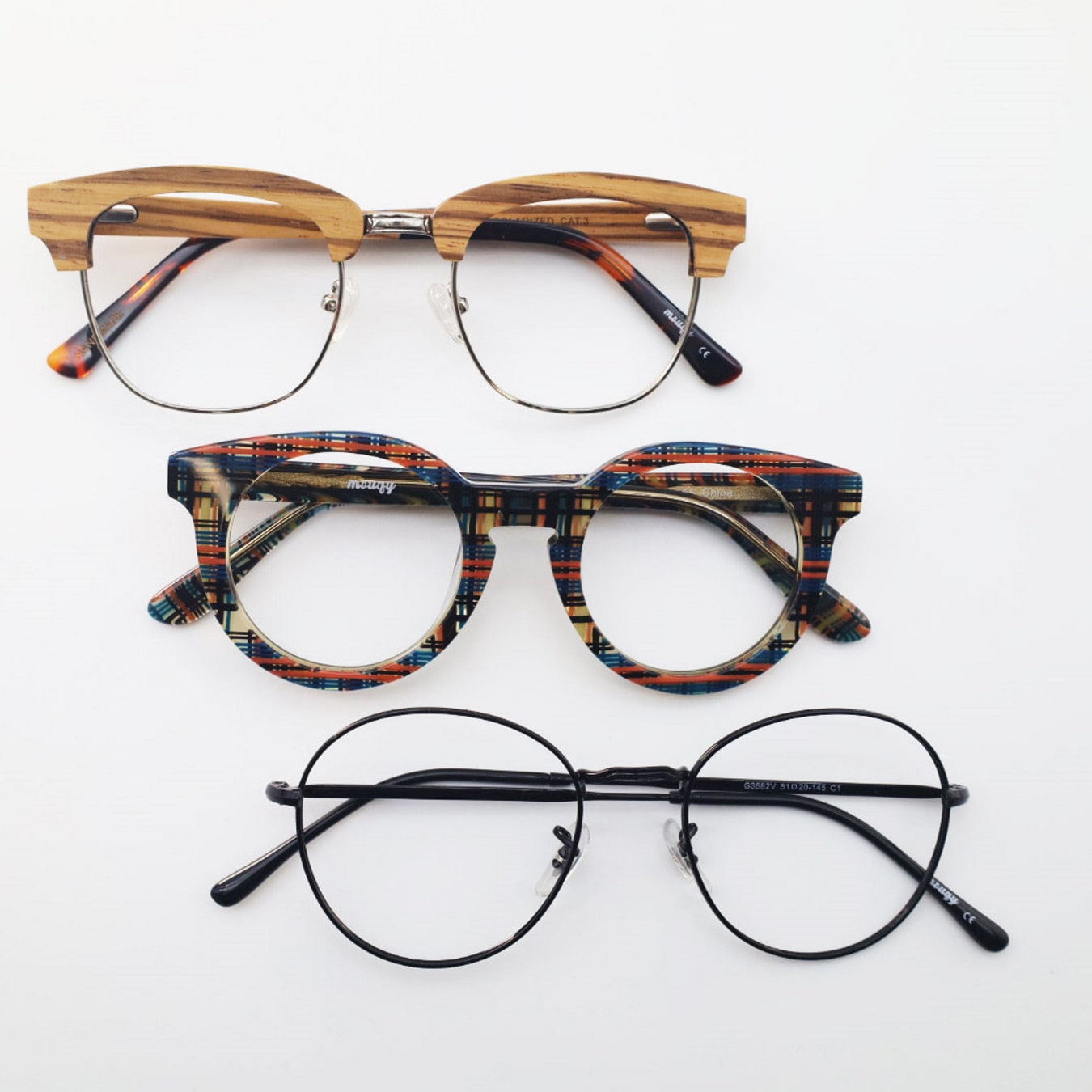 3 pairs glasses frames made of wood plastic and metal