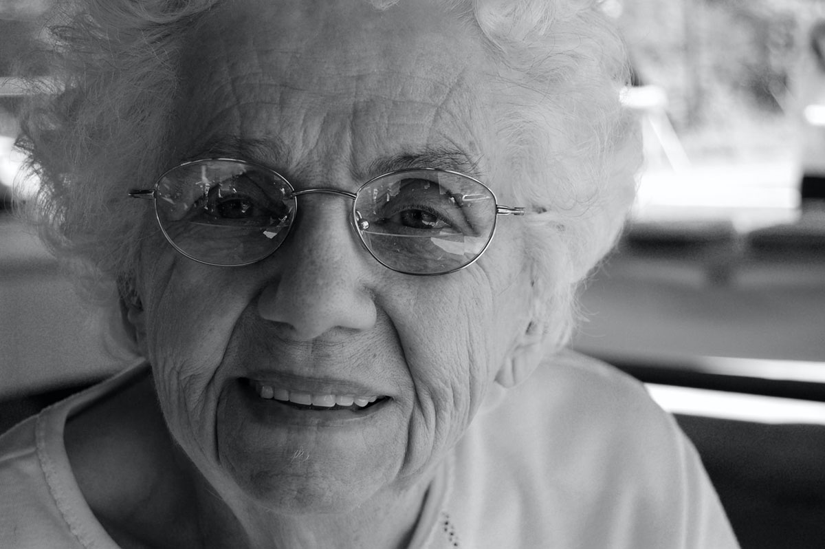 elderly woman wearing a pair of eyeglasses