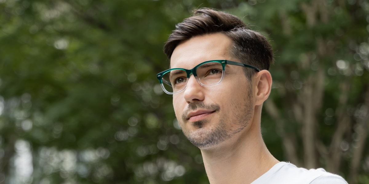 man wearing a pair of progressive glasses in the outdoors