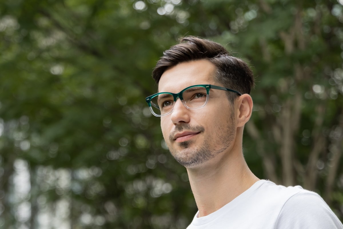 man wearing a pair of progressive glasses in the outdoors