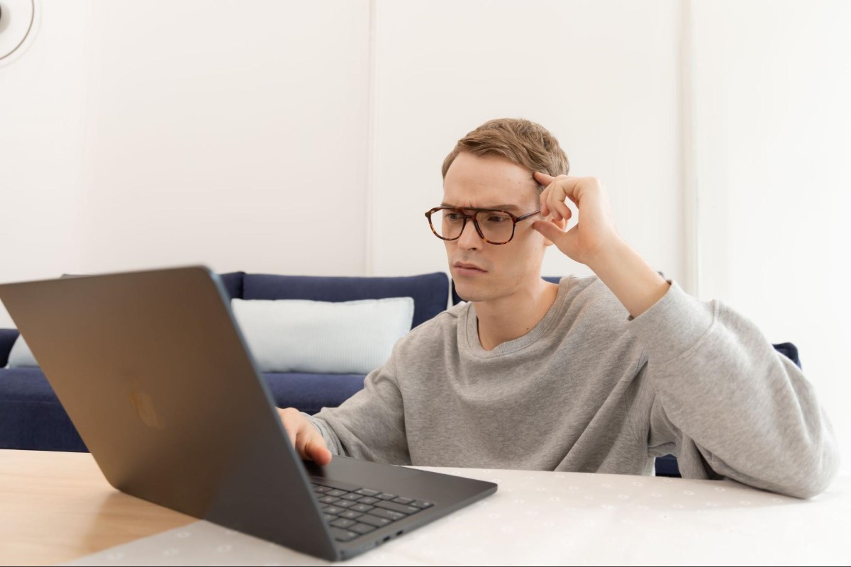 man working with glasses on