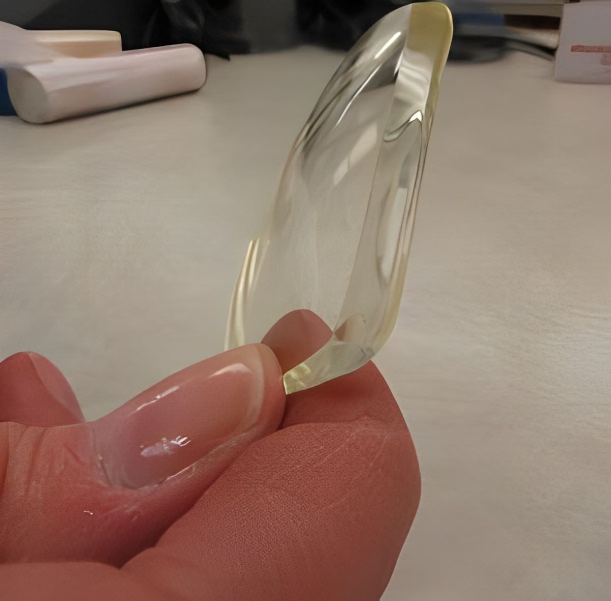 a piece of polished lens that look shiny and transparent