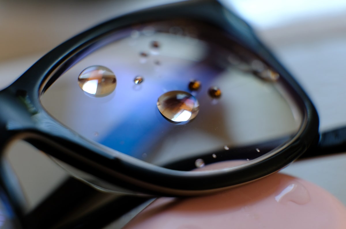 a piece of prescription lens with hydrophobic coating