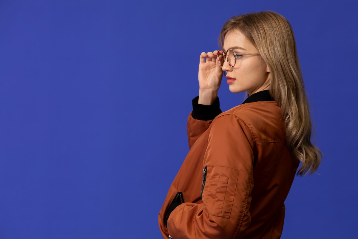 woman posing with glasses on