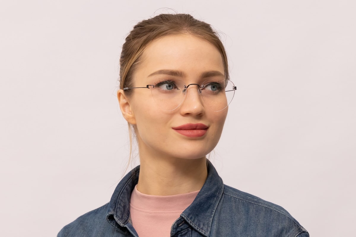 woman wearing a pair of rimless heart shape glasses