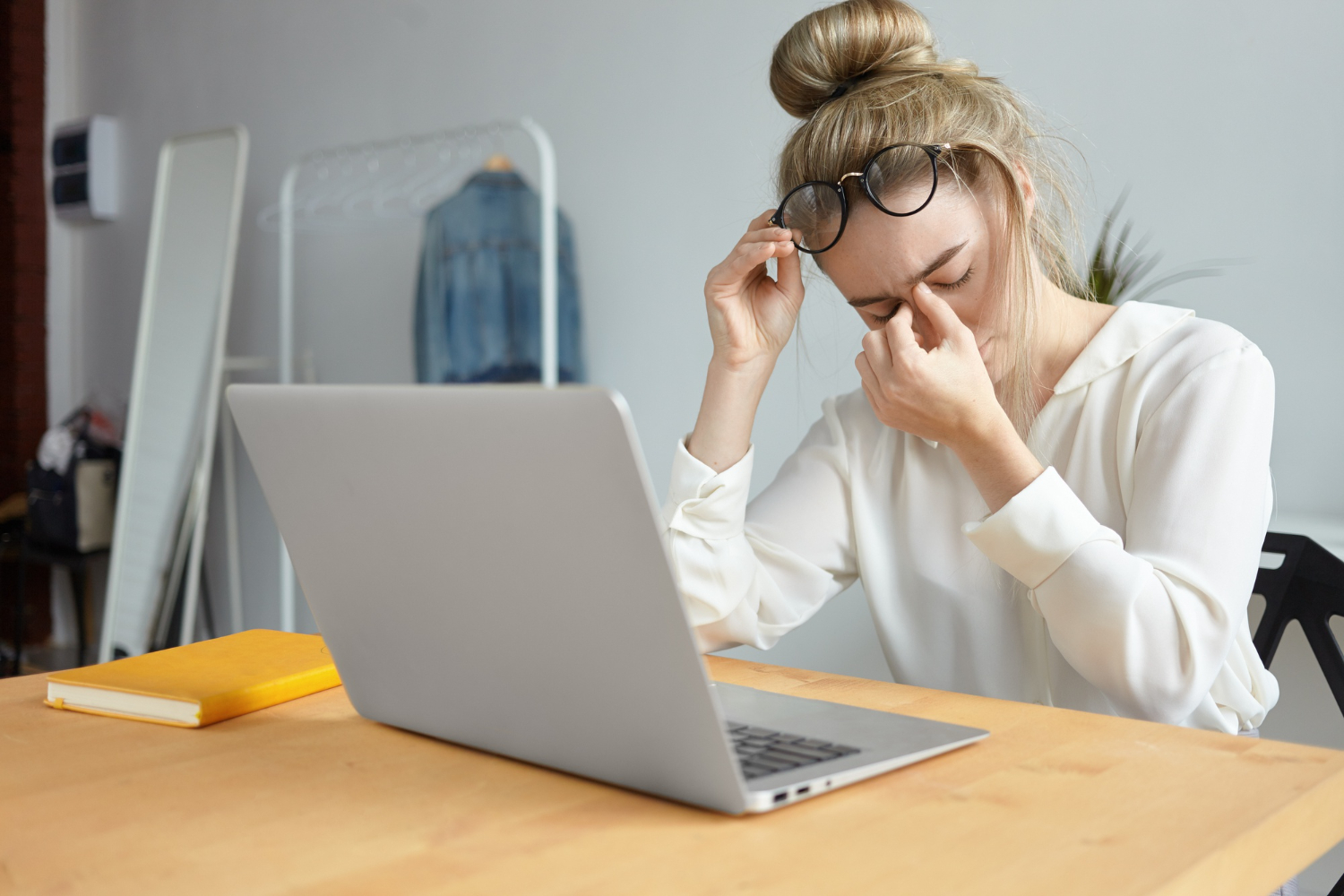 Woman rubbing eyes due to irritation