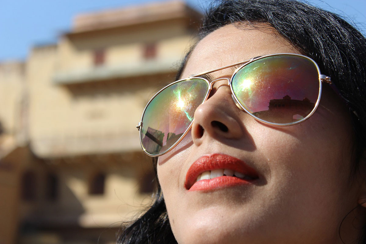 woman wearing sunglasses to protect her eyes outdoors