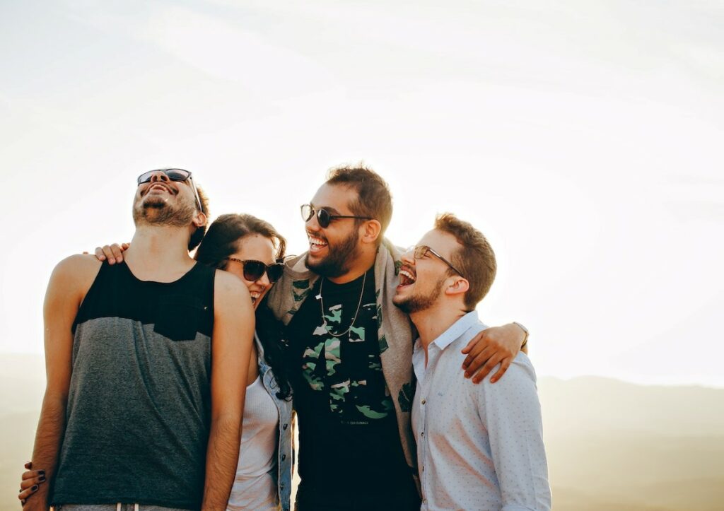 happy group of friends in glasses