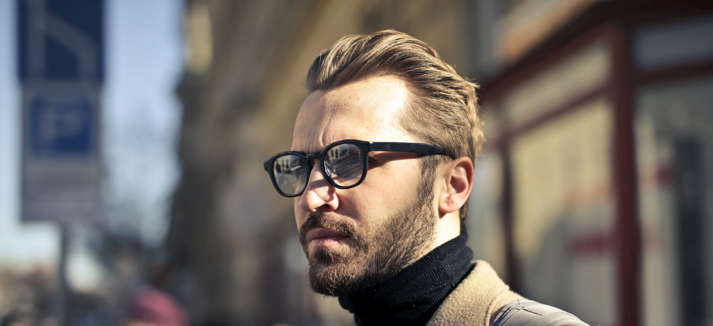 man wearing eyeglasses that flatter his long face