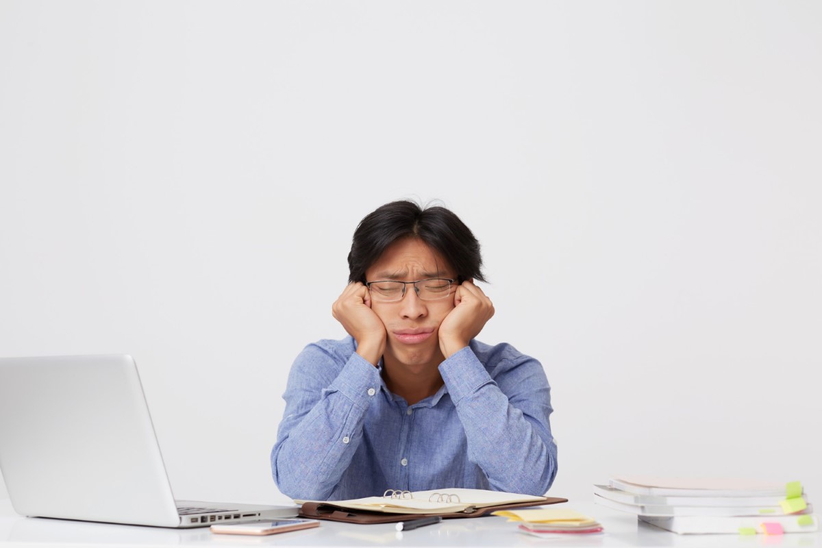 stressed working man in glasses