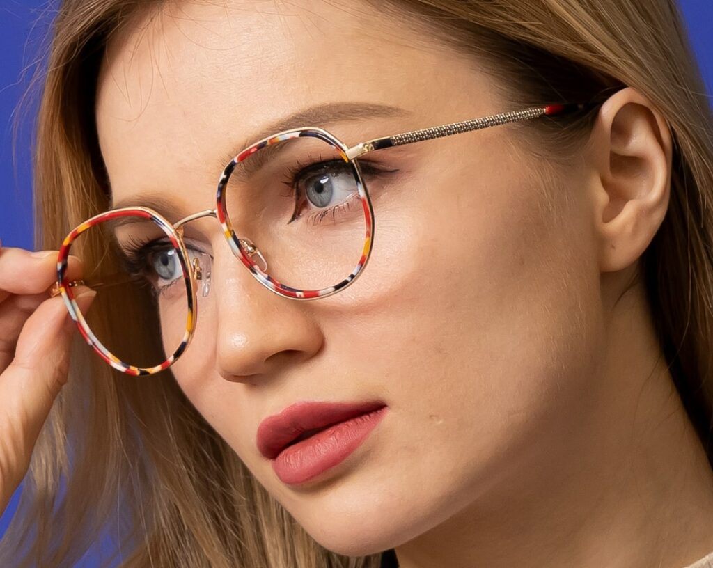 woman showing off her eyeglasses temple arm