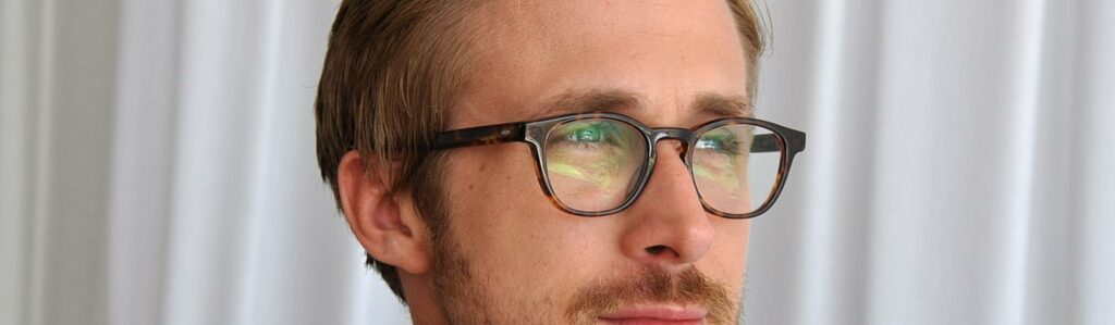 ryan gosling wearing glasses that match his blonde hair