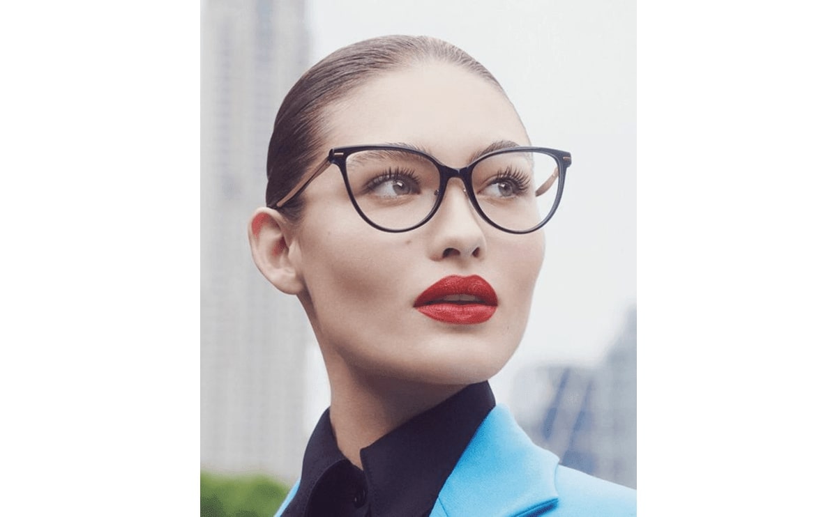 lightly feathered brows balancing out a strong looking glasses frame