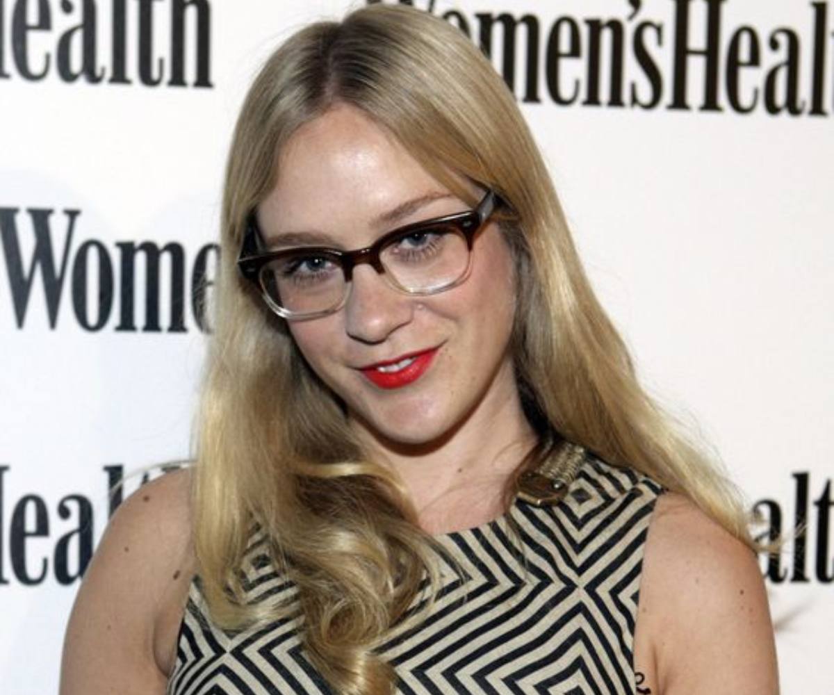 chloe sevigny in browline glasses with bright red lips