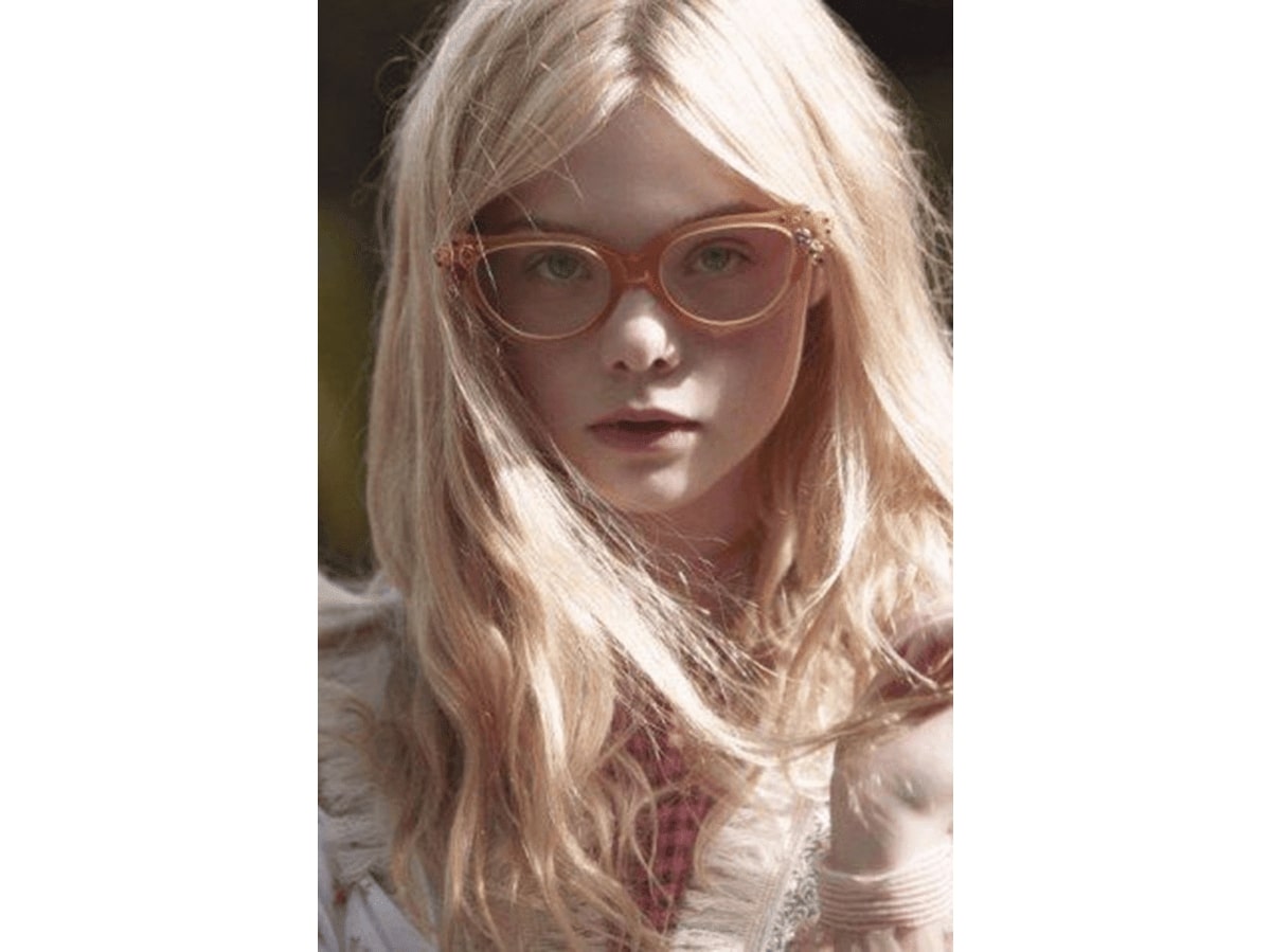 elle fanning wearing a pair of pastel glasses