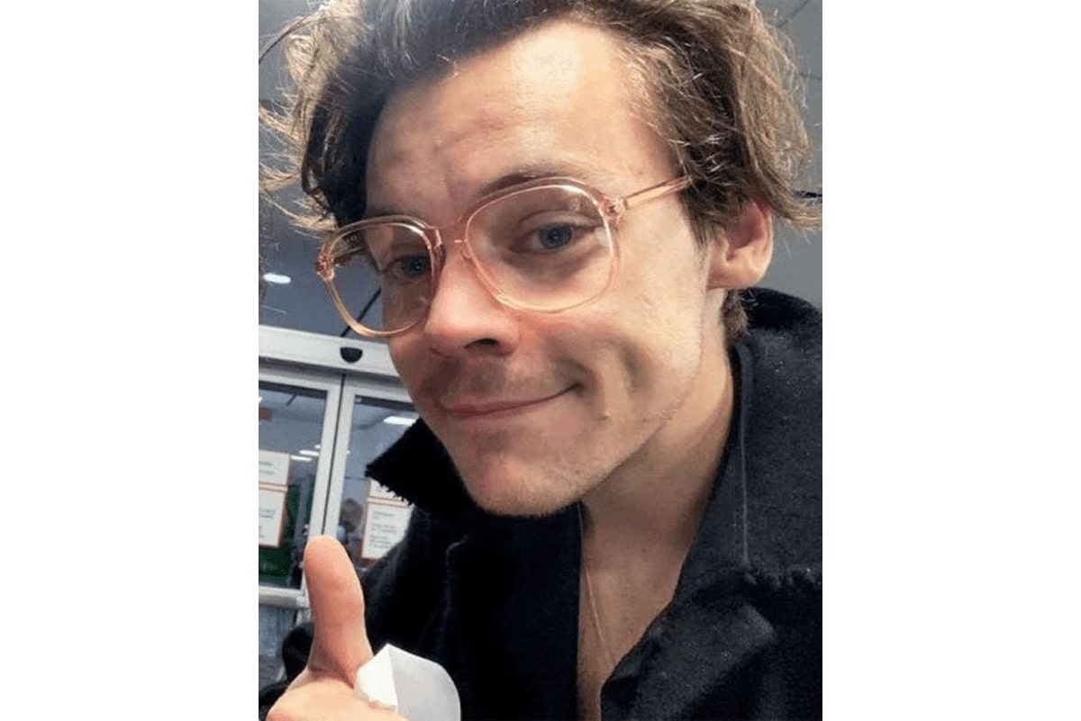 harry styles wearing a pair of pastel glasses