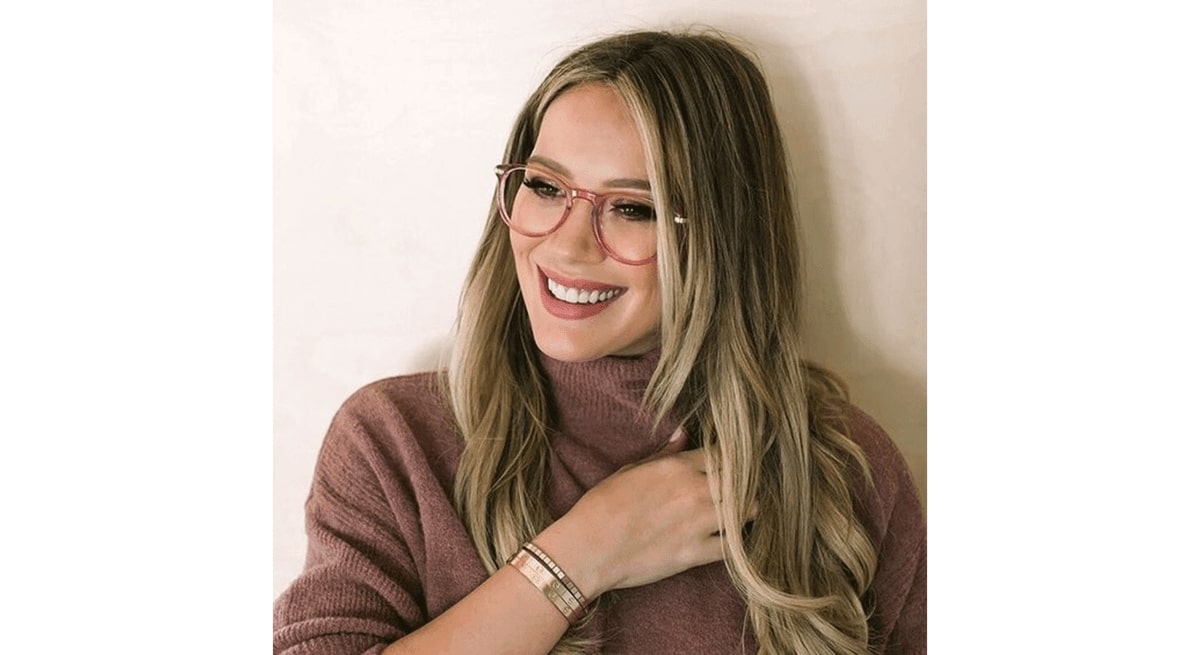 hilary duff wearing a pair of pastel glasses