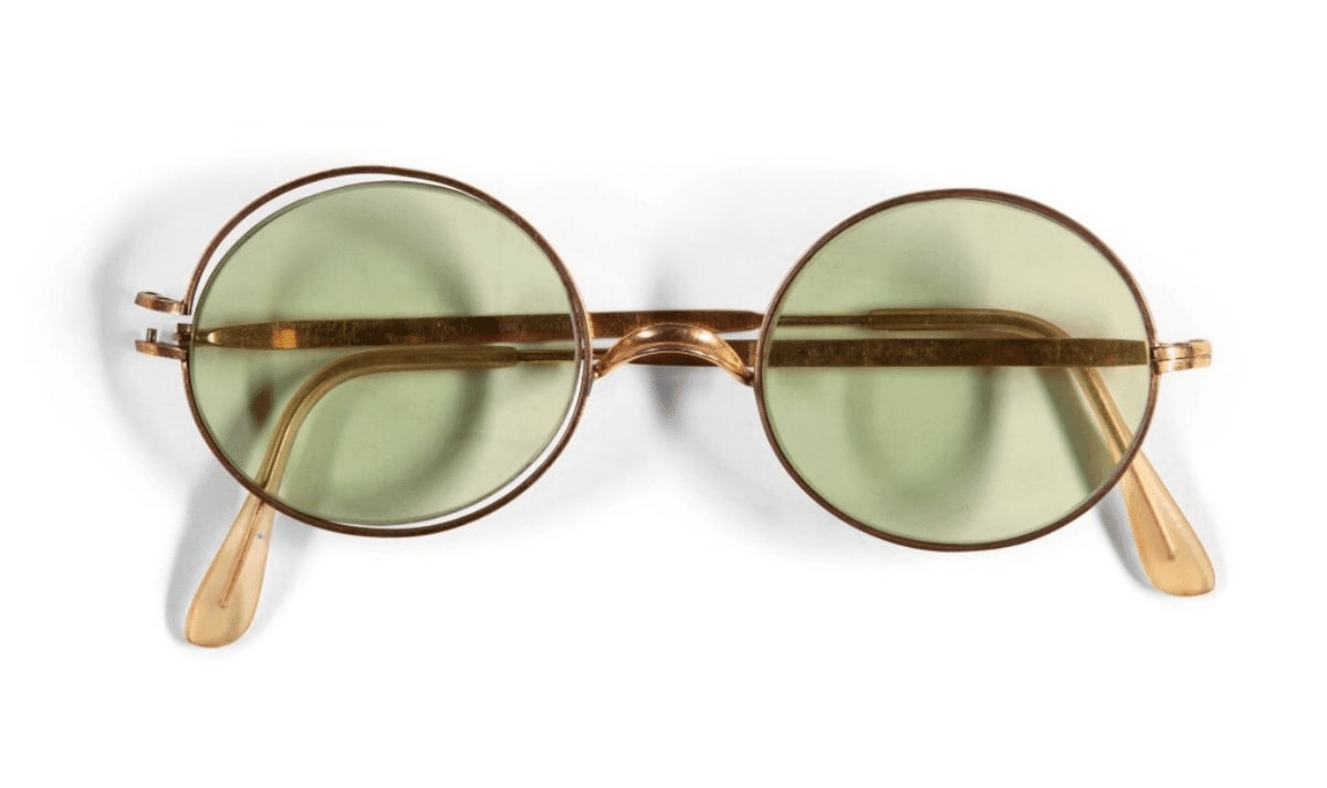 a pair of green tinted sunglasses owned by john lennon