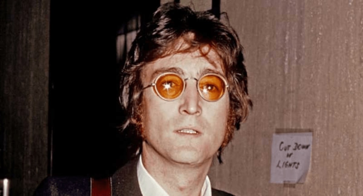 john lennon wearing a pair of round glasses