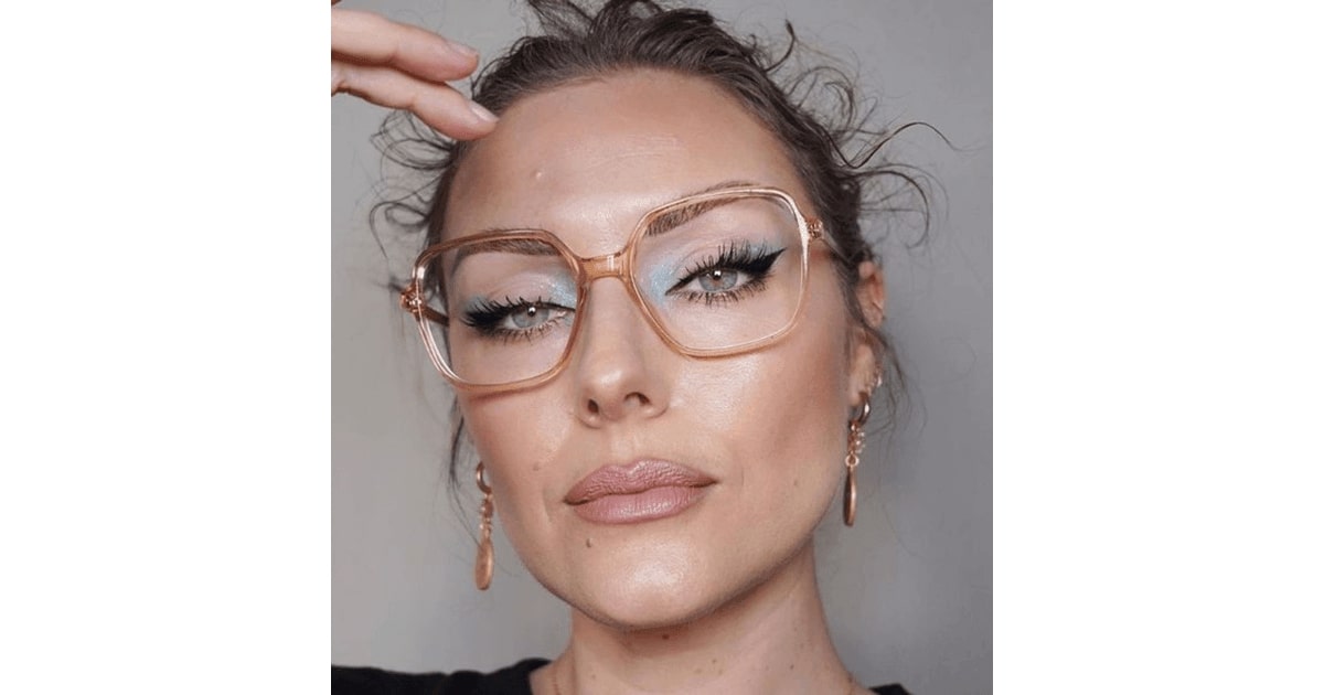 katie jane hughes wearing a pair of glasses with blue eyeshadows