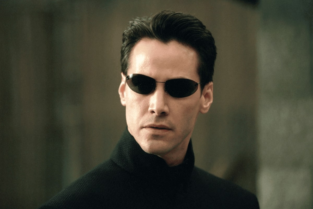 keanu reeves with a pair of sunglasses in the movie matrix
