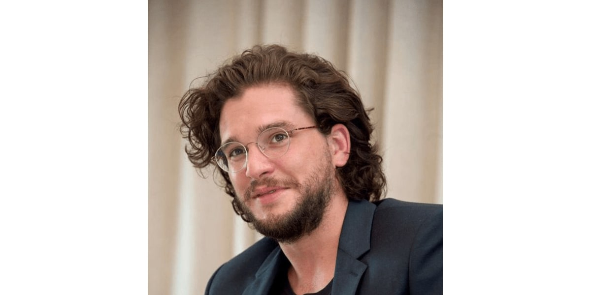 kit harington wearing a pair of round glasses frame