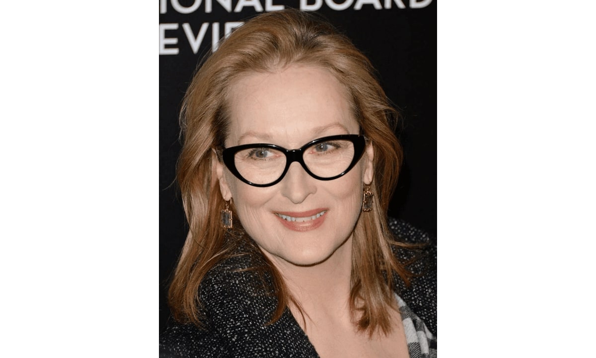 meryl streep wearing a pair of black cat eye glasses