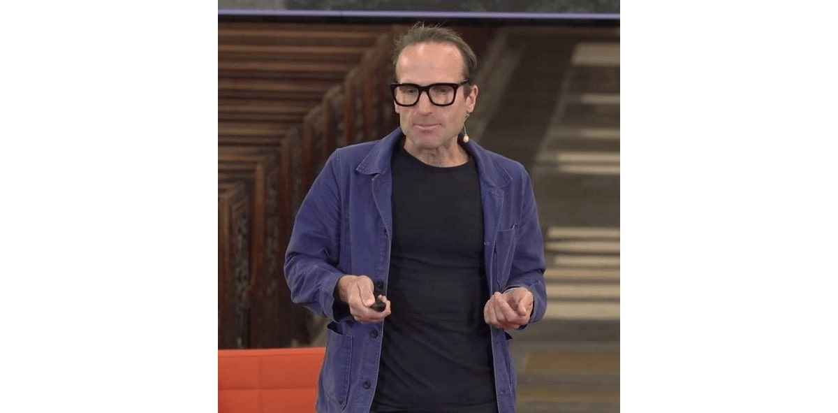 piers taylor wearing a pair of square glasses frame in a ted talk