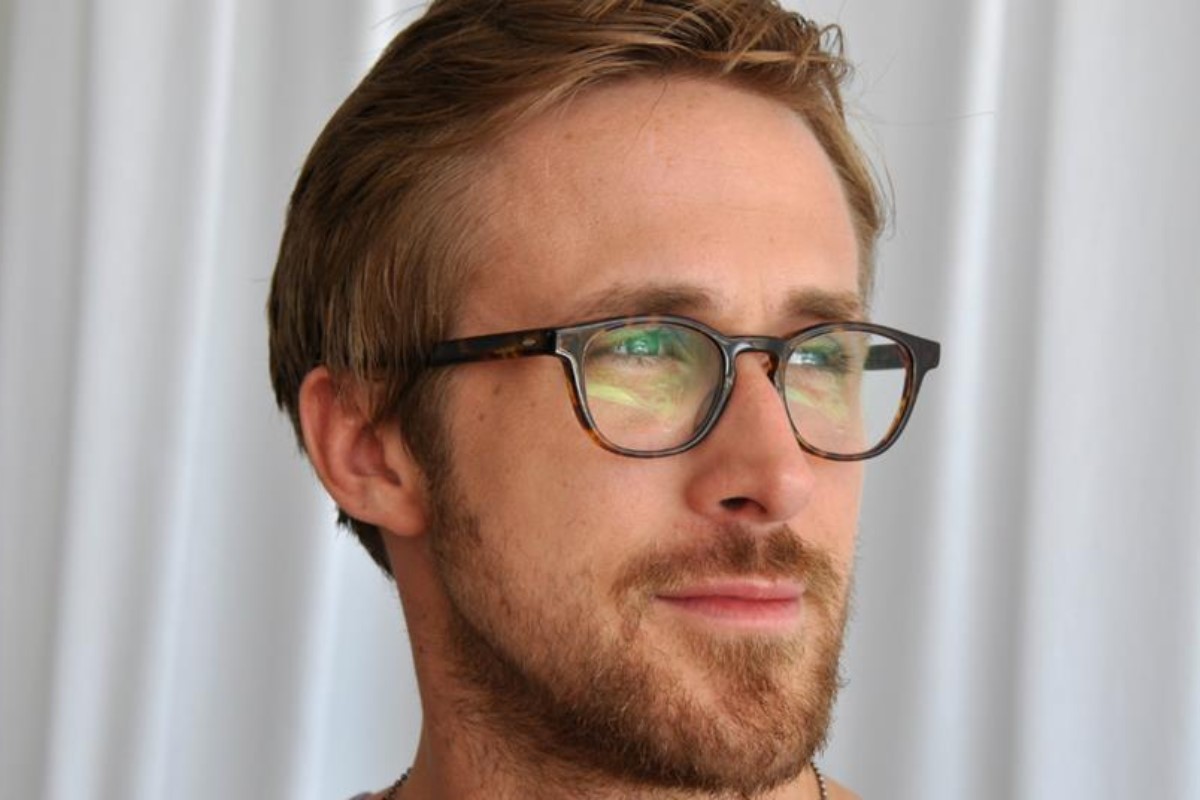 ryan gosling with blonde hair in tortoiseshell glasses
