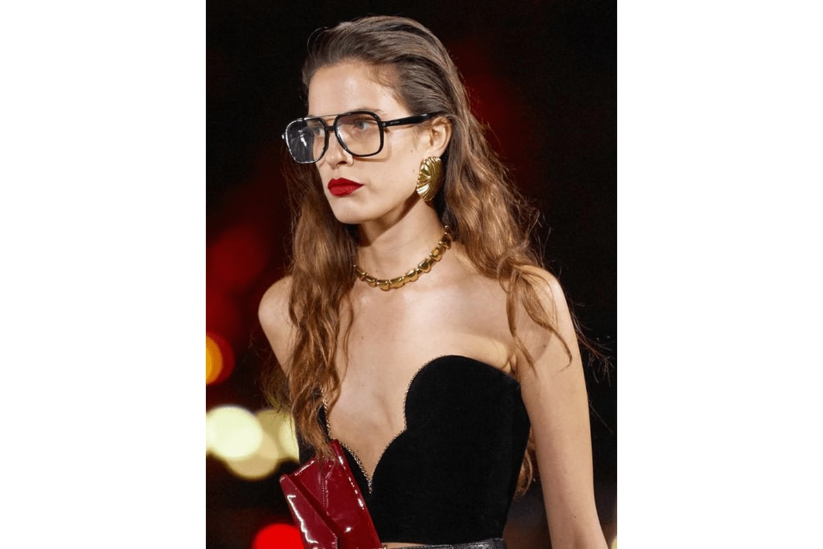 a model wearing a pair of aviators in the saint laurent ss 2022 show