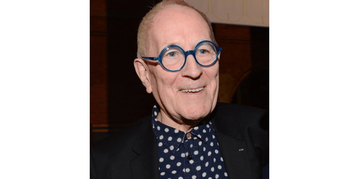 sir peter cook wearing a pair of blue glasses frame
