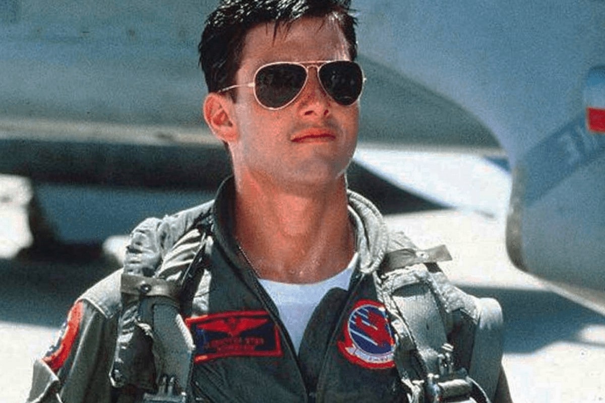 tom cruise with a pair of sunglasses in the movie top gun