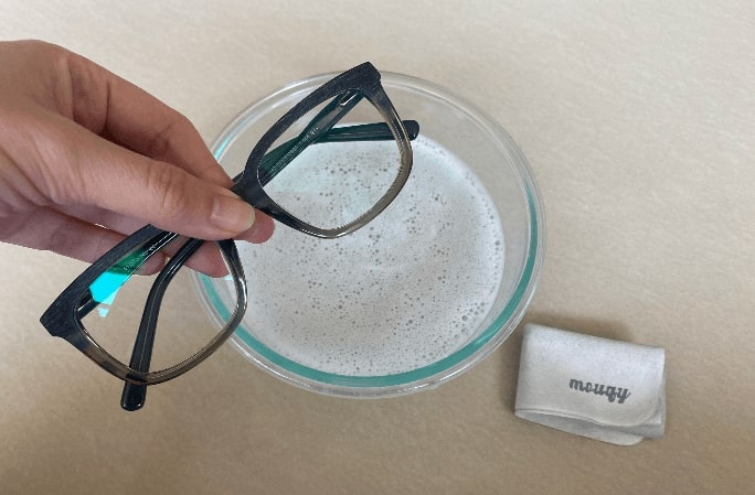 clean eyeglasses with soapy water