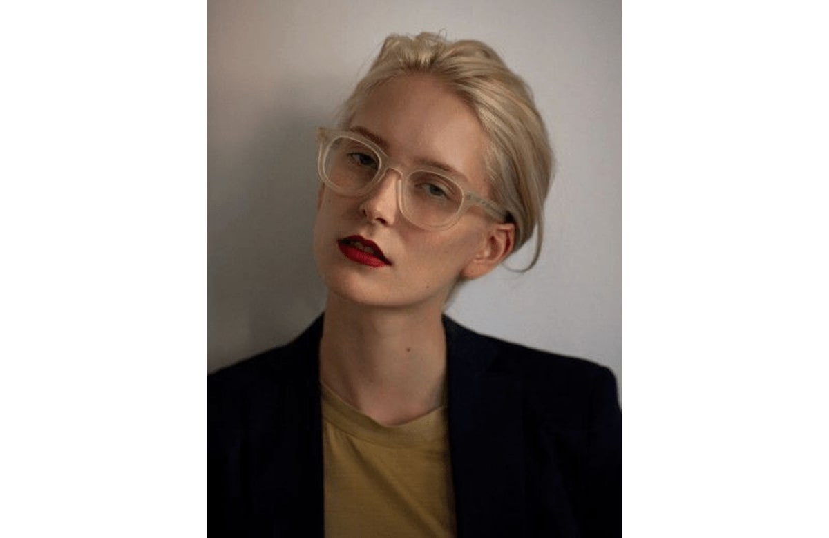 a woman wearing a pair of acetate glasses frame