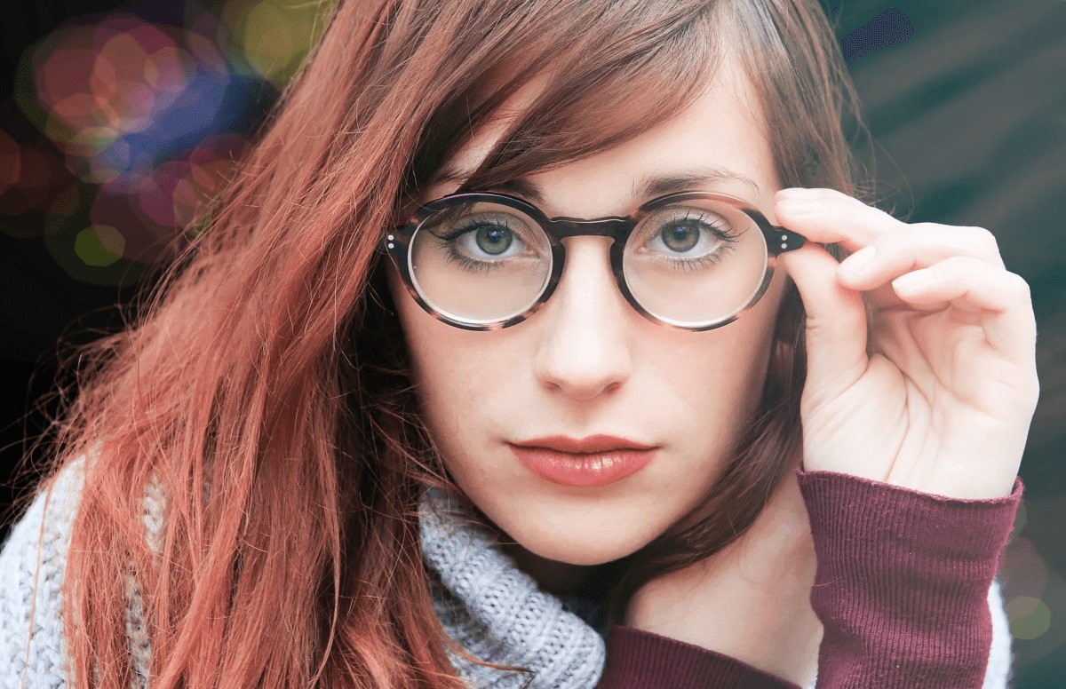 woman wearing a pair of round acetate glasses