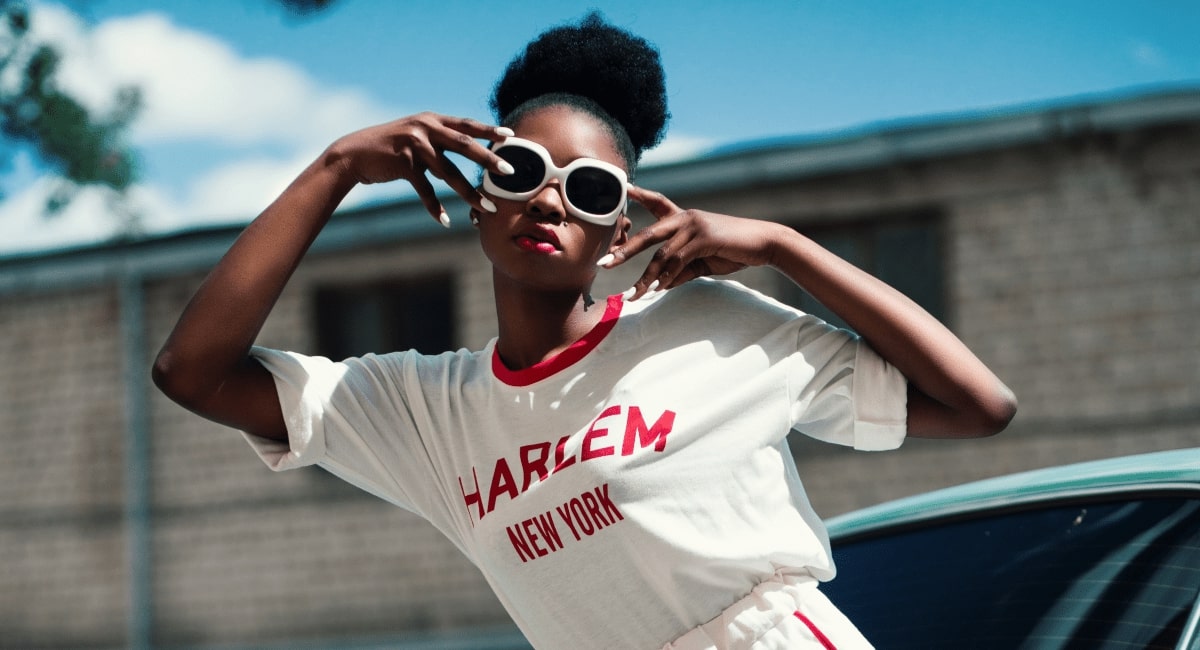 a woman wearing a pair of white oversized frame