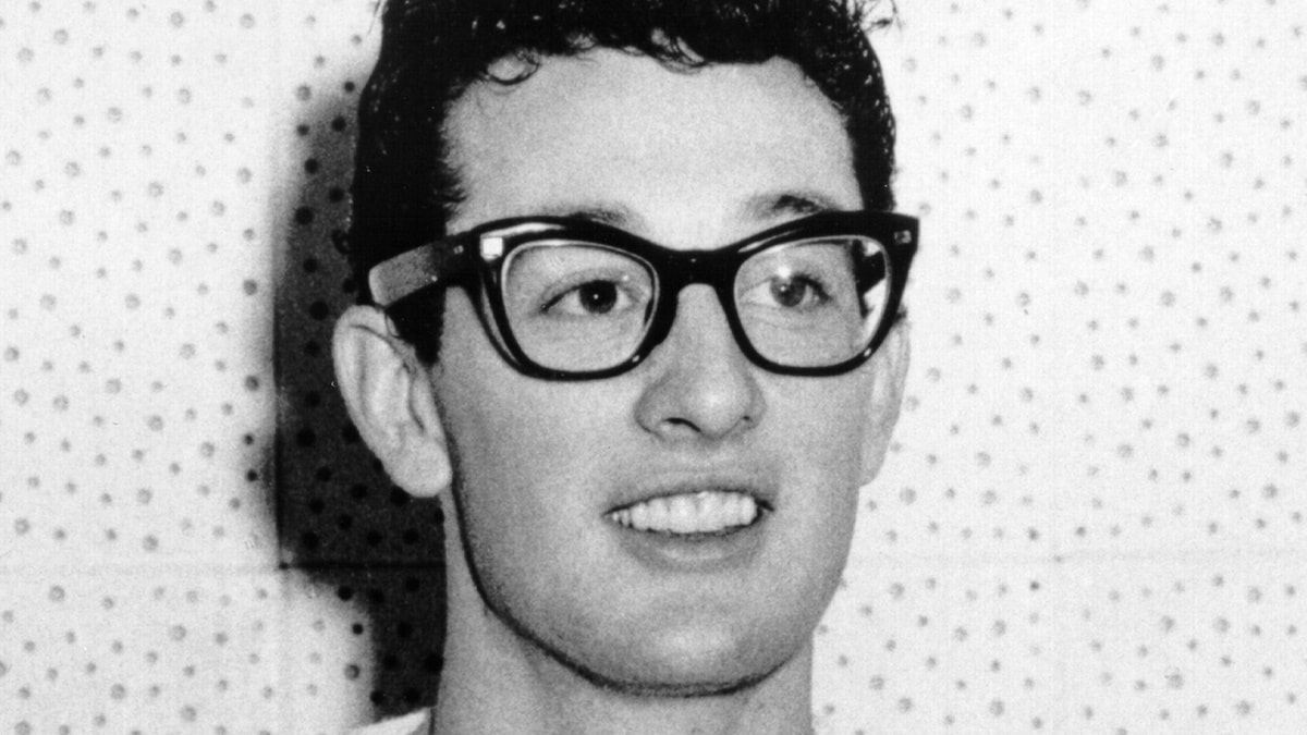 buddy holly wearing a pair of black cat eye glasses