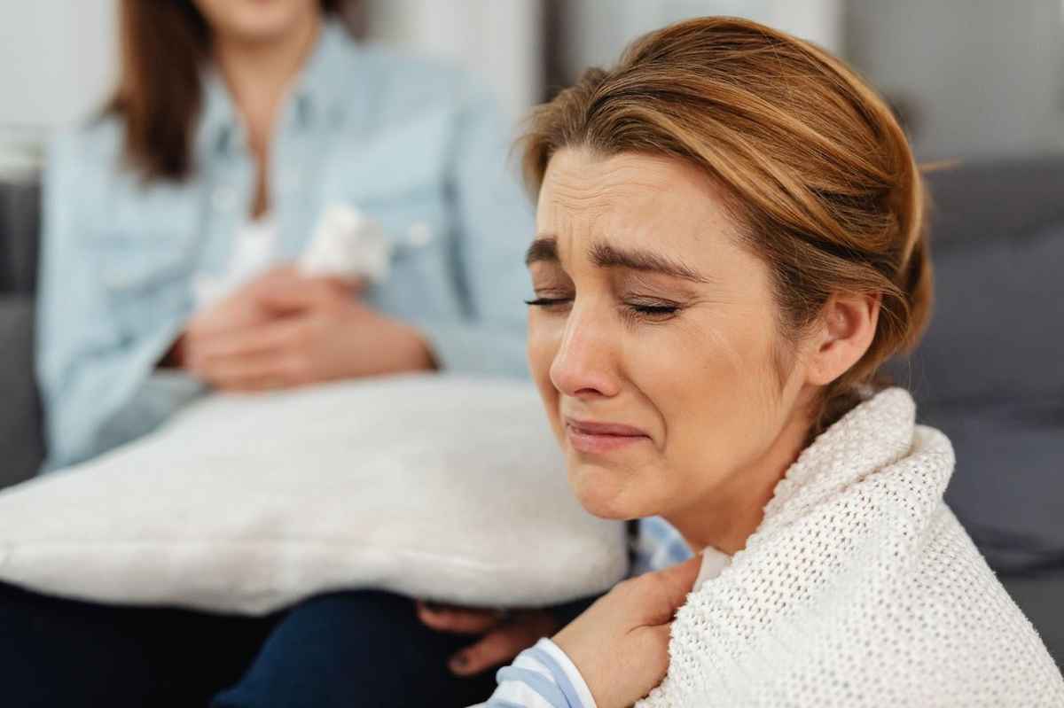 blonde woman crying due to emotions