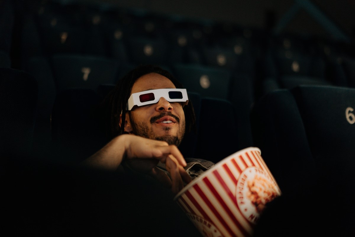 man wearing a pair of anaglyph glasses while watching 3d movies