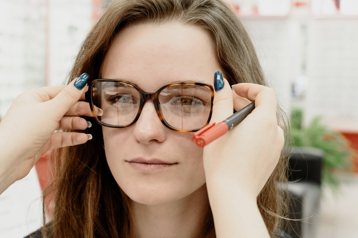 lady trying addons on her eyeglasses