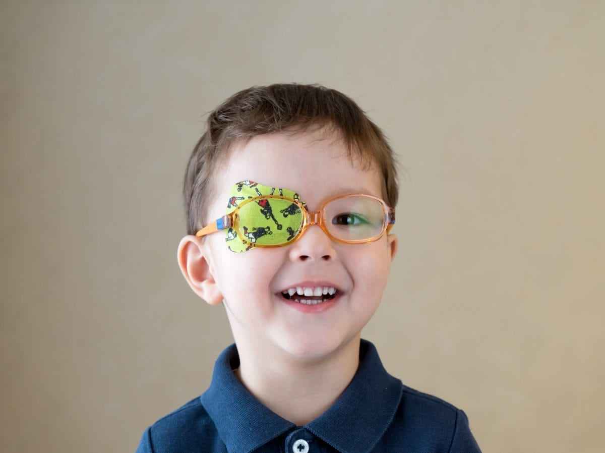 a boy wearing an eye patch to treat lazy eye