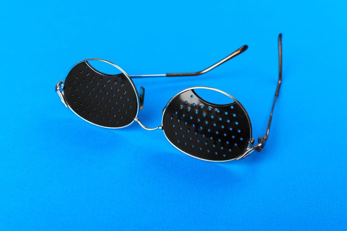 a pair of pinhole stenopeic glasses